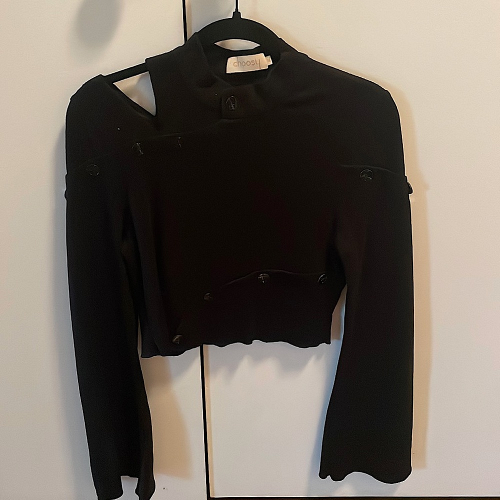 Black cropped top with button details open right slit  shoulder detail